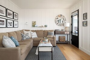 Living area and front entry off of main deck. 