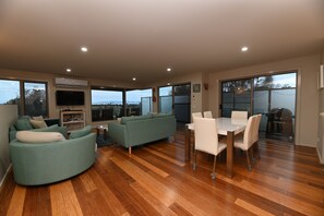 Living room include dining table.