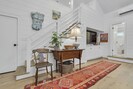 65” smart tv and stairs to bedroom