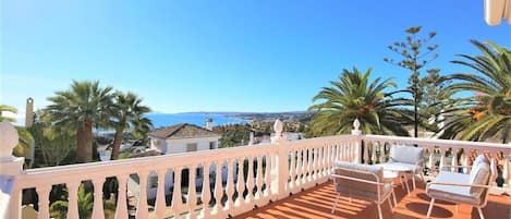 Spacious terrace facing south with sea views and outdoor seating area