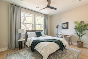 Bedroom with desk, room darkening curtains and great natural lighting to enjoy.