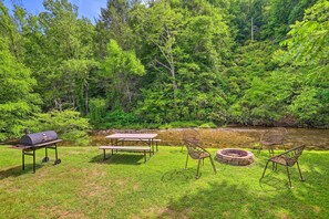 Private Yard | Outdoor Dining Area | Fire Pit | Charcoal Grill | Creek On-Site