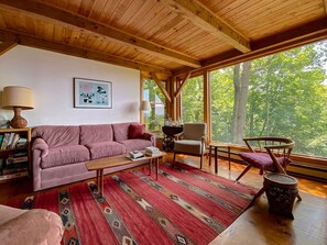 Comfortable living room with beautiful view and wood burning stove.