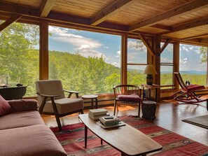 Comfortable living room with beautiful view and wood burning stove.