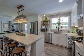 Kitchen - Bama Cottage is newly renovated and the kitchen is gorgeous. It is stocked with the utensils and appliances you will need to make snacks or a home cooked meal.