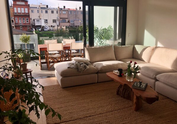 View of living room open onto balcony.
