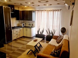 Kitchen combined within lounge area. You can cook your meals and enjoy food here