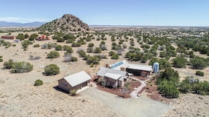 Ariel view of house and 600 sq foot garage. Famous Lone Butte in background