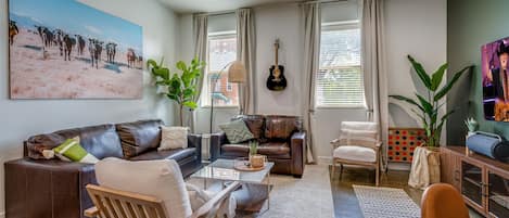 Bright and open living area with smart TV.