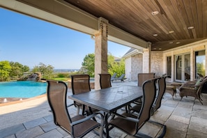 Covered patio overlooking pool and city 