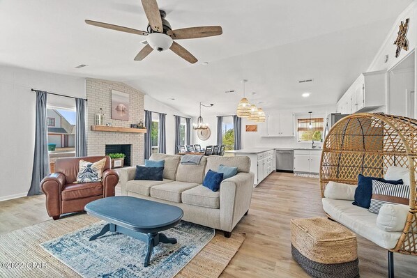Living room has vaulted ceilings, creating a spacious and inviting atmosphere
