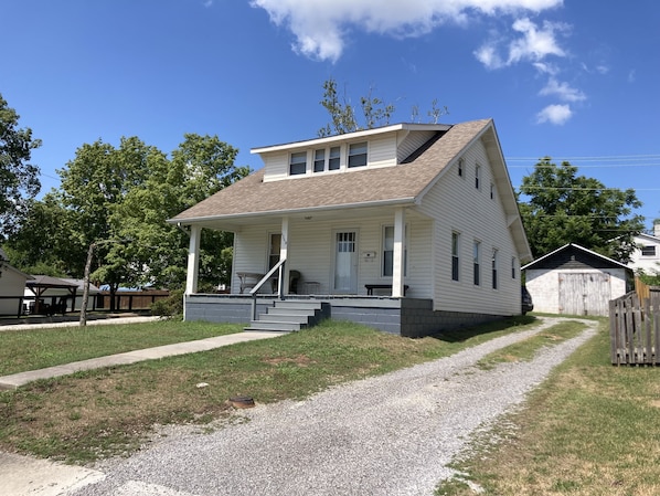 Front of house on corner lot with driveway