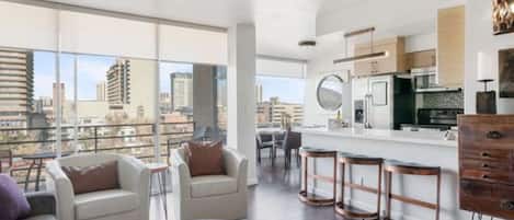 Spacious kitchen with a bar table and dining area, offering a beautiful view