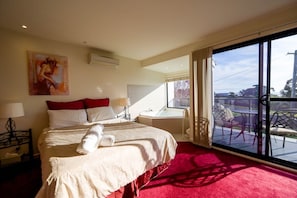 Queen size bed with Fluffy Bath towels and balcony access