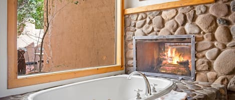 jacuzzi tub with fireplace