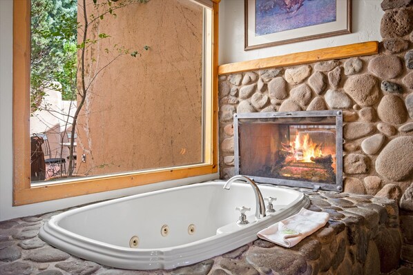 jacuzzi tub with fireplace