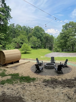 fire pit and barrel sauna with glass front to gaze at the mountains and stars