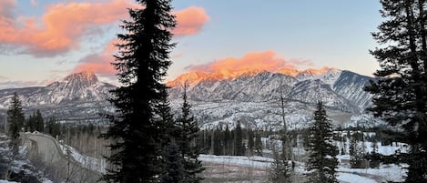 The view. As the sun sets, the shadows climb the mountains.