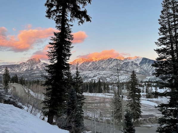 The view. As the sun sets, the shadows climb the mountains.