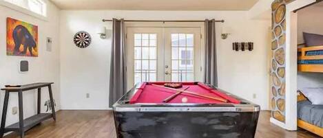 Game room with pool table and darts