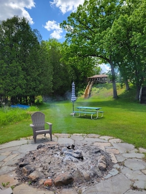 Fire pit with cottage at top