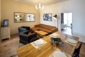 Living room with kitchenette and large dining room