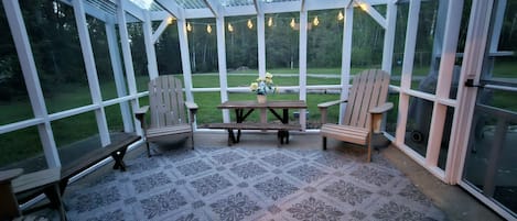 Enjoy the outdoors while keeping bugs away inside the screened porch