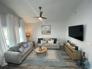 Living Room with 60" smart TV and comfy seating 