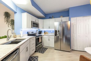Kitchen with Quartz countertops and stainless steel appliances