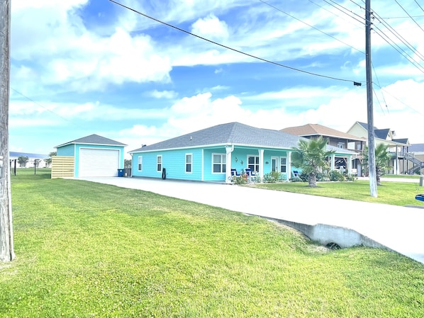 Home on corner with 2 drive entrance - additional drive added for more parking.