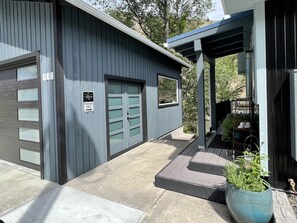 Entryway to 1 bedroom R&R unit is down the stairs between the building & garage 