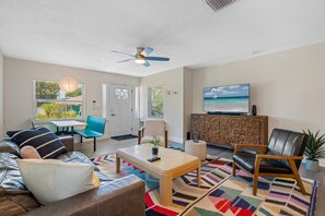 Spacious living room with a cozy couch where you and your family and friends can bond and relax. If you have any questions about this property, please don't hesitate to send us an inquiry.