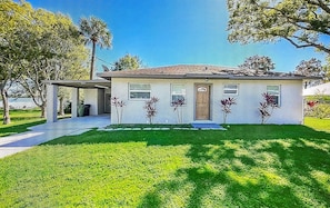 Front of house from the street. Lake is directly behind house!