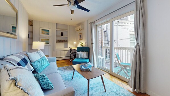 Living room , open to sliding doors filling it with natural light