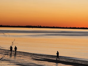 View this stunning sunset on beach directly across the road from the apartment. 