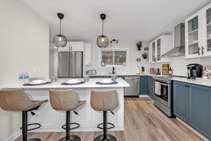 Food central - modern appliances, island and well stocked w/ cooking utensils