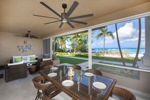 Furnished Patio with beachfront views.