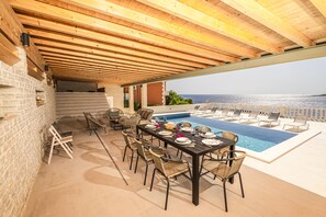 Dining terrace overlooking the pool