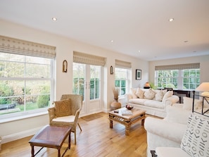 Light filled lounge with french doors out to the garden and large windows