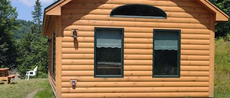 Cozy cabin in the woods to retreat to after your days adventures.
