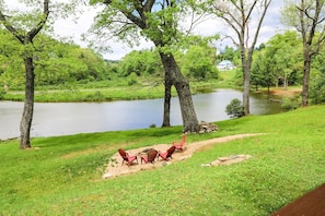 Enjoy the outdoor firepit and the pond