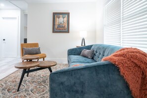 Signed art competes this styled living room in Fort Myers - artful abode.