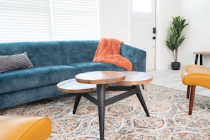 Artist's choices are in the living room in artful abode, close to downtown. 