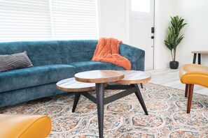Artist's choices are in the living room in artful abode, close to downtown.