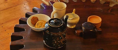 Hot English tea with cookies, curled up with blanket sitting next to wood stove
