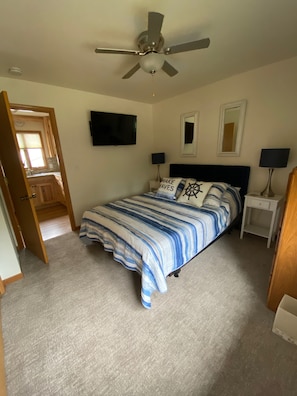 Main bedroom includes smart TV and large closet
