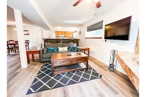 Check out this inviting living room with 50HD TV wood fireplace and seating