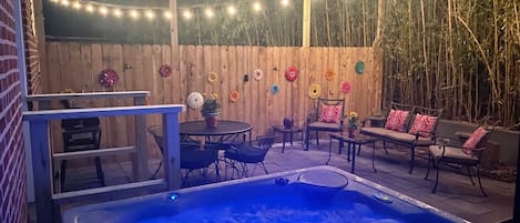 Hot Tub and Back Patio at Dusk - Travelers Post 1