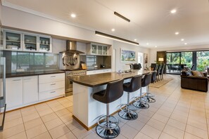 The kitchen is fully-equipped for your holiday catering with additional seating at the breakfast bar.
