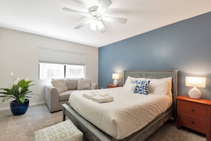 Master bedroom w/ queen size bed, love seat, 50" Smart TV (w/ Youtube TV live) & private bathroom